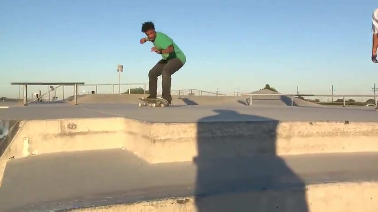 Sora 2 AI video: skateboarders on a sunny rooftop